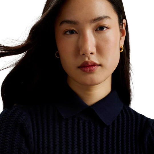 Lady in Textured Knit Sweater with Classic Collar