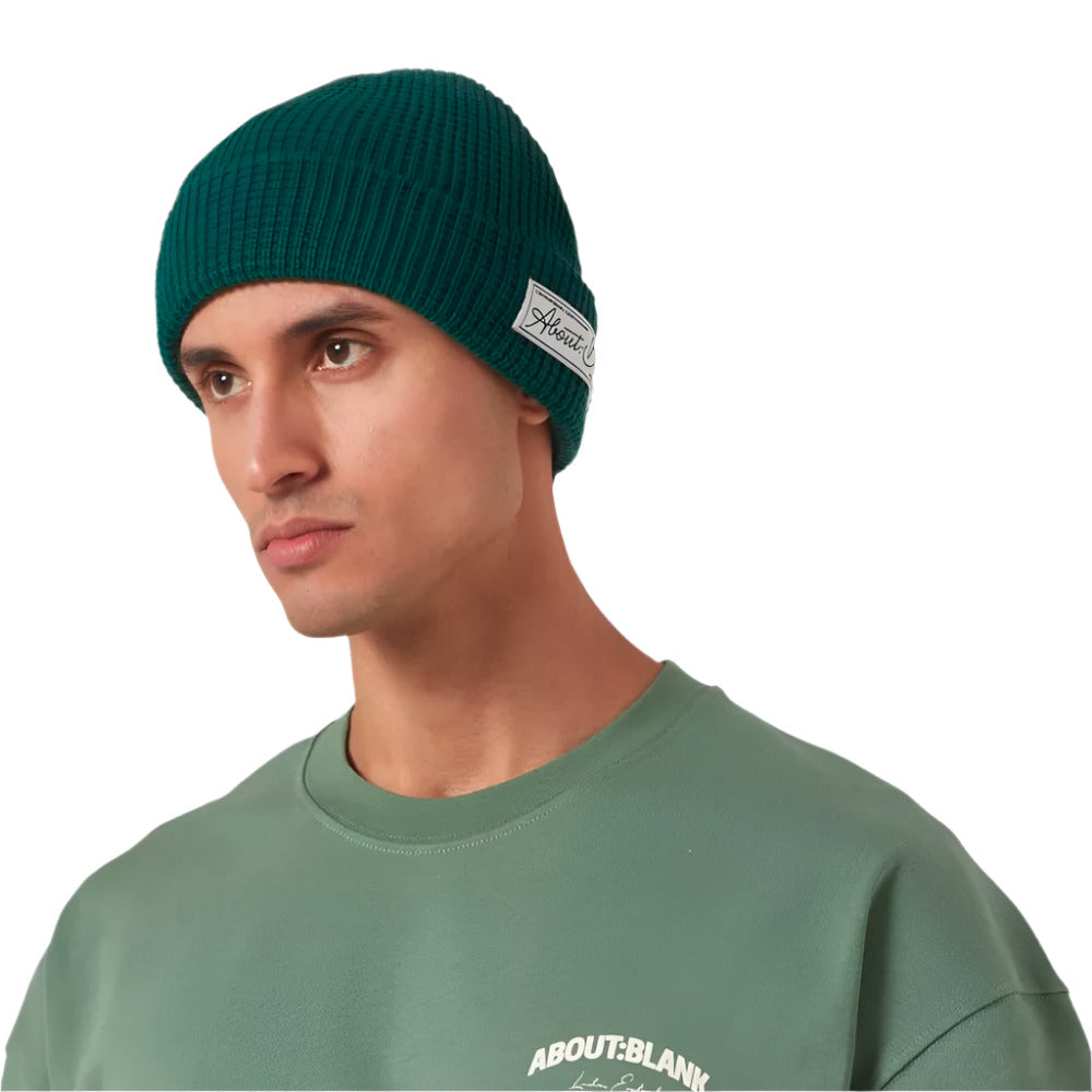 A model wearing About Blank Epsom Green Waffle Knit Beanie