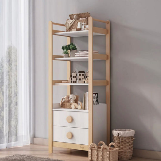 Wooden shelf with white drawers and decorative items against a gray wall.