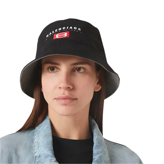 A female model wearing Balenciaga Unisex All Seasons Black Cotton Bucket Hat