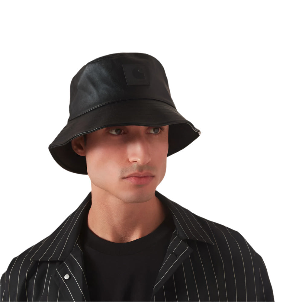 A model wearing Carhartt WIP Norwich Faux Leather Black Bucket Hat
