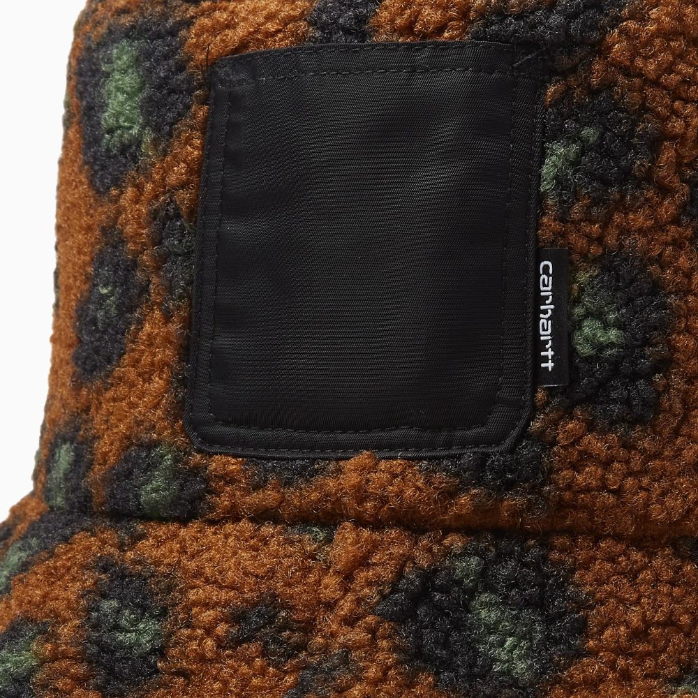 Close-up of the Carhartt WIP Orla bucket hat showing the textured fabric and logo patch.