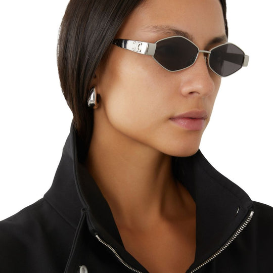 A women wearing Celine Women's Metal Triomphe Oval Sunglasses