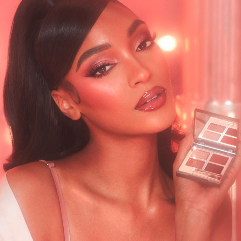 A model with Luxury Palette in Pillow Talk Dreams in her hand