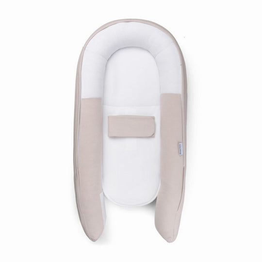 Baby Nest with beige and white design on a white background