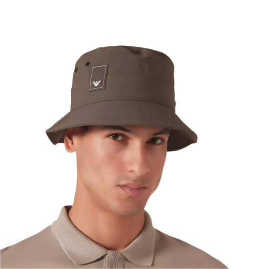 A model wearing Emporio Armani Classic Breathable Brown Bucket Hat with Eagle Patch