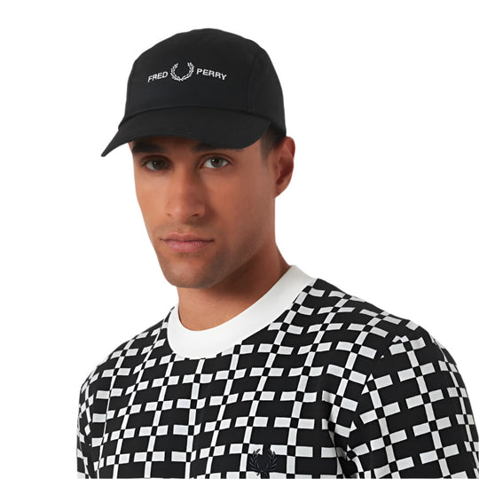 A model wearing Fred Perry Five-Panel Cotton Twill Black Cap with Logo Embroidery