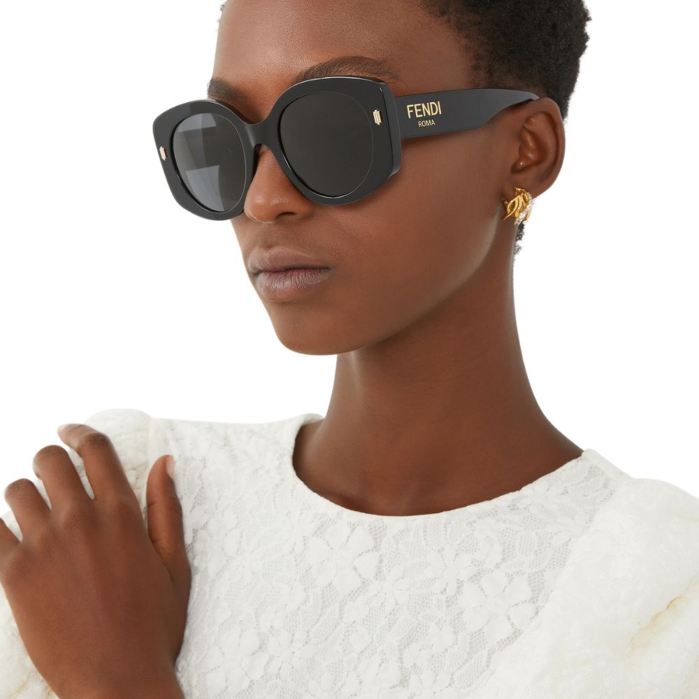 A model wearing Fendi Women's Roma Oversized Black Sunglasses