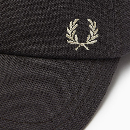 A close up shot of embroidery on Fred Perry Classic Cotton Piqué Dark Grey Baseball Cap