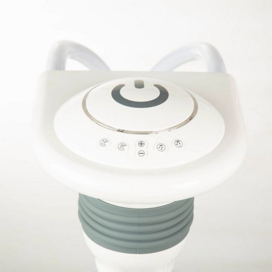 White electronic device with control panel on a white background