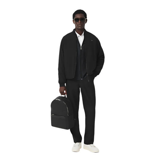 A black model with LACOSTE Chantaco Pique Leather Black Backpack