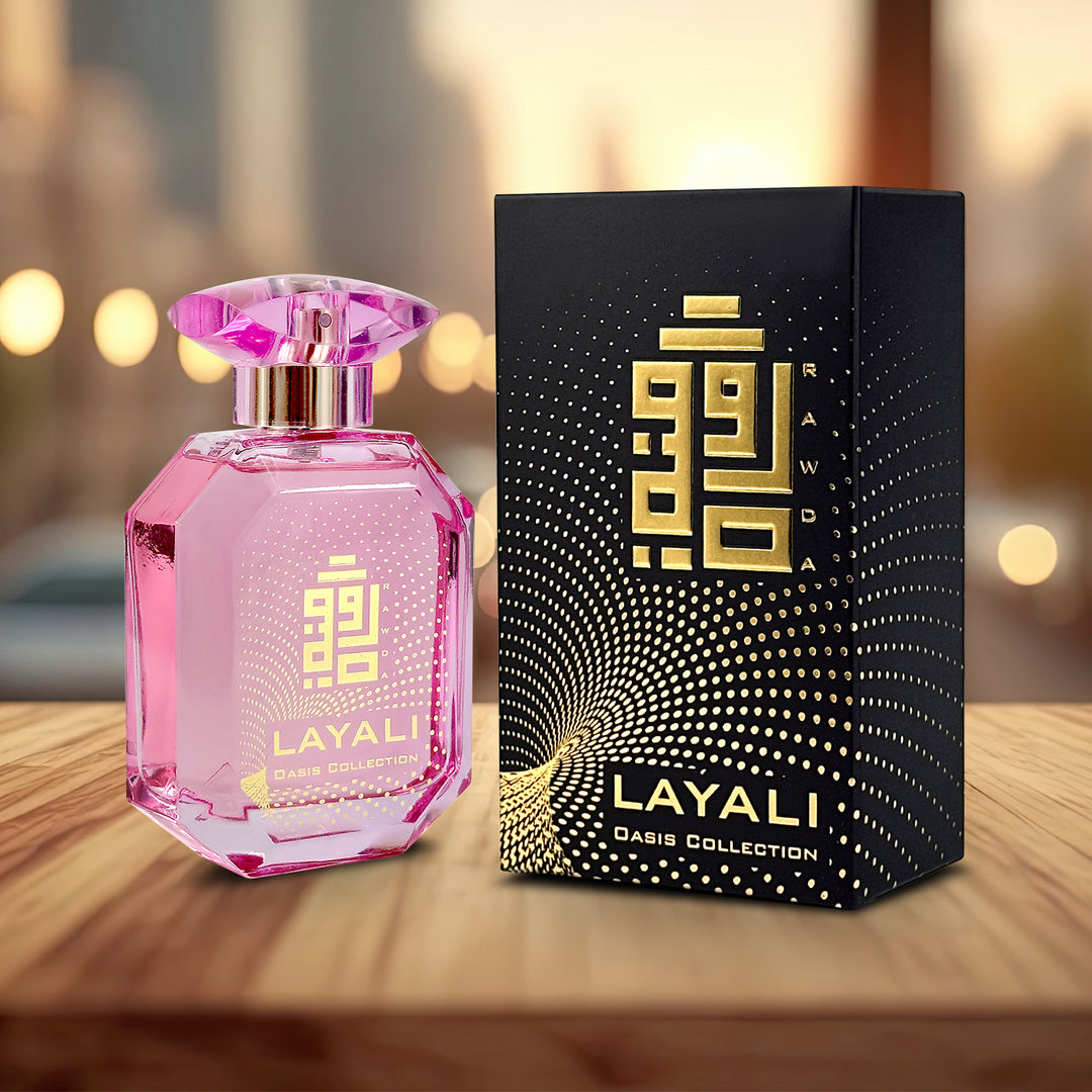A  EDP 110mL bottle of Layali fragrance by Rawda along with its Box kept on a Wooden Surface