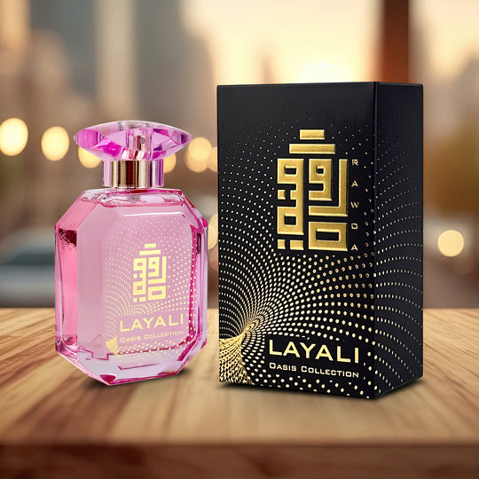 A  EDP 110mL bottle of Layali fragrance by Rawda along with its Box kept on a Wooden Surface