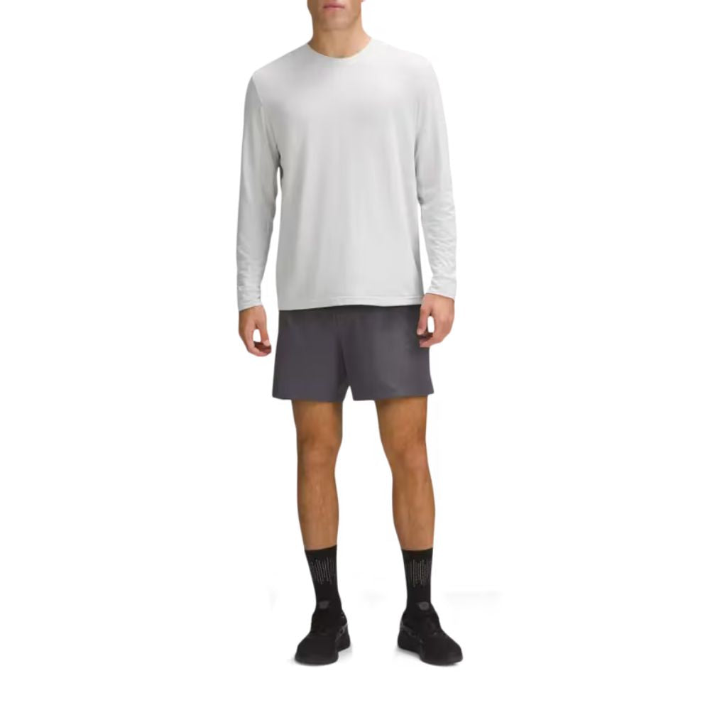 A male model waering LULULEMON License To Train Relaxed Long Sleeve T-Shirt