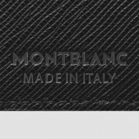 Montblanc logo embossed on a textured black surface with 'Made in Italy' text.
