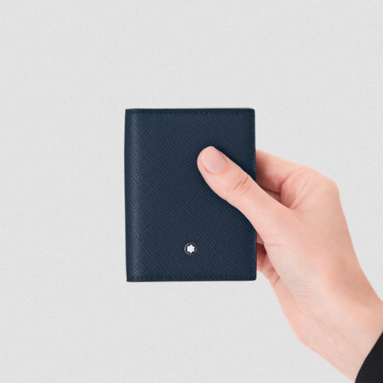 Hand holding a Montblanc Sartorial Ink Blue Saffiano 4-Card Holder - Sustainable Leather against a white background