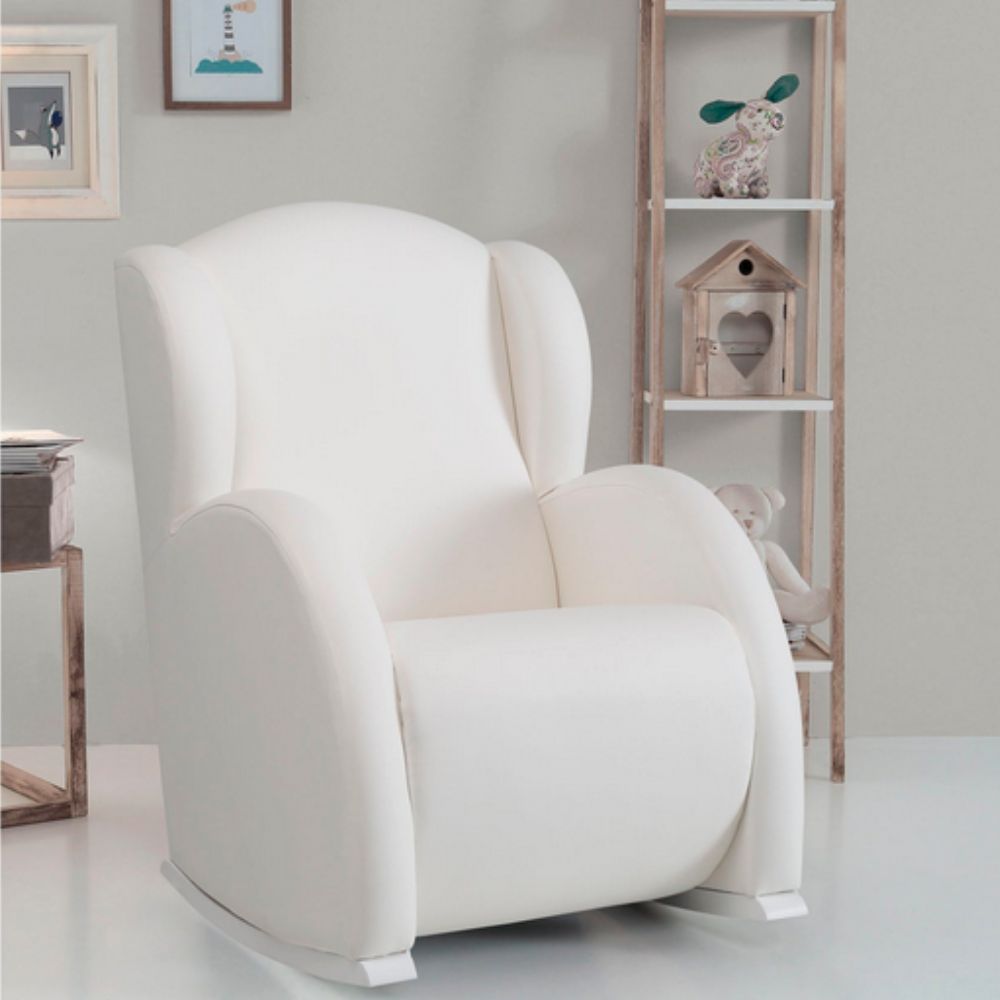 Micuna Flor Slow System Rocking Chair in a room with a wooden shelf and decorative items.