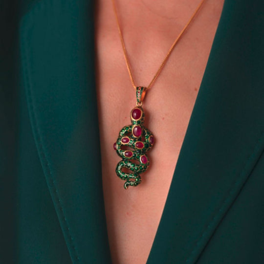 Close up of Moiseau Serpent Kiss Pendant worn by a lady