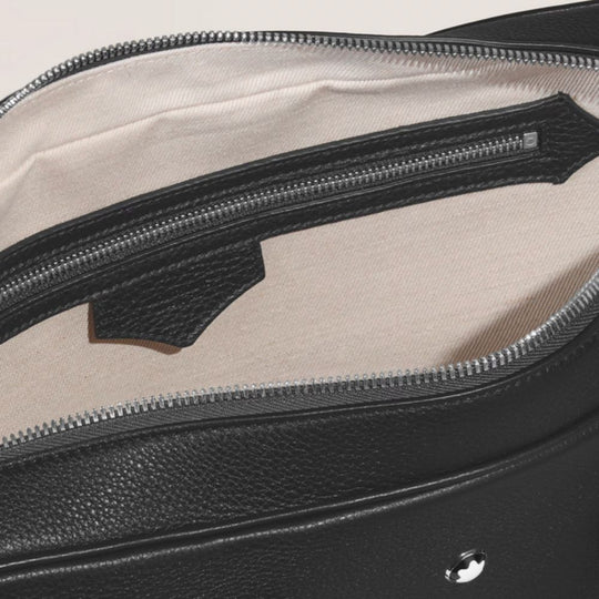A close-up view of the open black Montblanc grain leather document case, showing the light-colored interior lining and a zippered internal pocket.