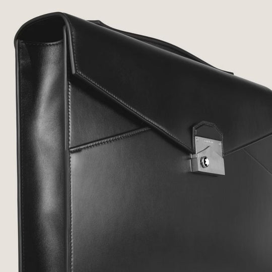 Montblanc Meisterstück Leather Flat Business Briefcase with a silver lock on a light gray background