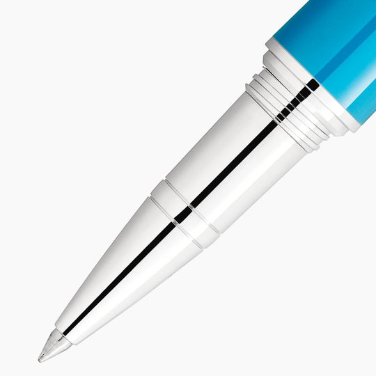 Close-up of the tip of a Montblanc Muses Maria Callas Rollerball pen, showing the metal tip, silver barrel, and turquoise resin section