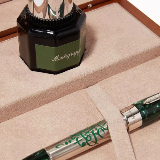 Montegrappa ink bottle and pen close-up, showing detailed craftsmanship and packaging.