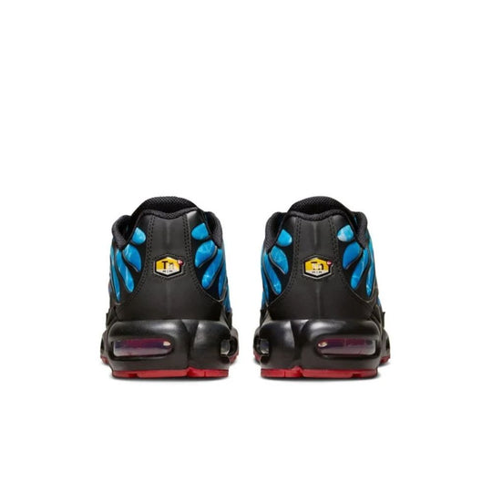 A rear view of the Nike Air Max Plus "Shark Attack" sneakers, featuring a bold blue and black design with a red accent
