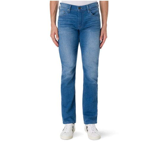 A male model wearing PAIGE Federal Kaufman Jeans