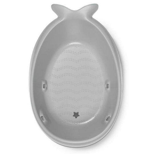 Gray whale-shaped object on a white background