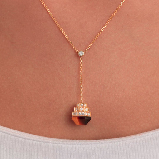 Neckline of a model wearing Samra Azm Yellow Gold Tiger Eye Necklace