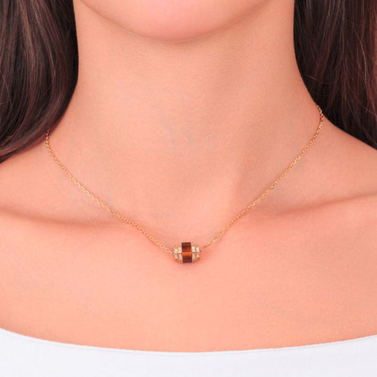 Neckline of a model wearing Samra Azm Yellow Gold Tiger Eye Single Necklace