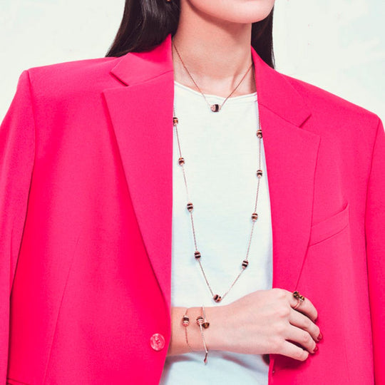 A model wearing Samra Azm Yellow Gold Tiger Eye Single Necklace