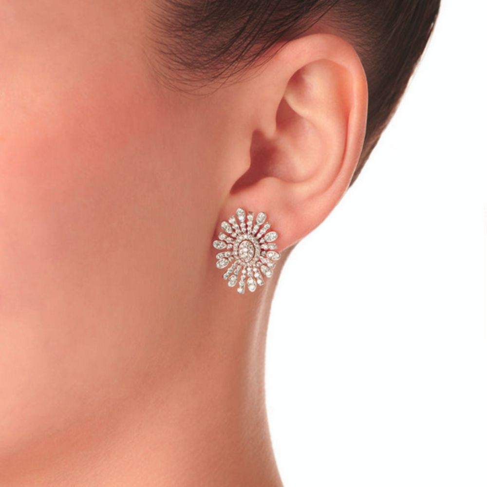 Close up of Samra Barq Oval White Gold Diamond Earring worn by a model