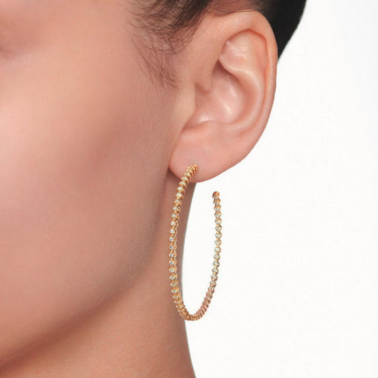 Close up of Samra Barq Yellow Gold Brilliant Diamond Large Hoop Earrings worn by a model
