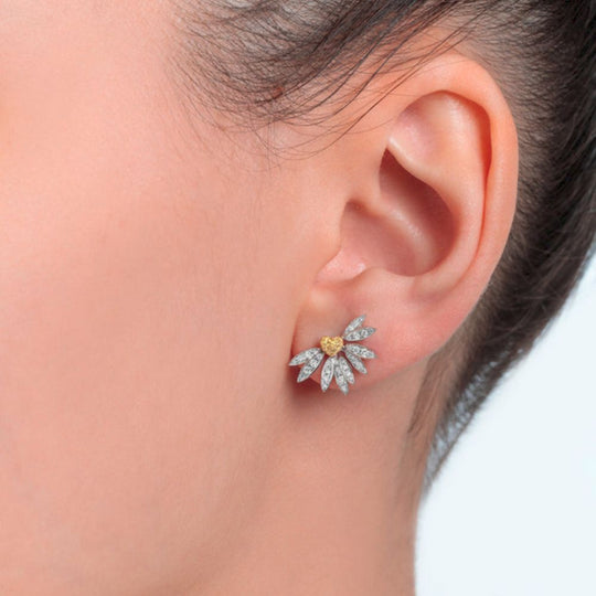 Close up of Samra Love Me Love Me Not Small Earrings on a model's ear