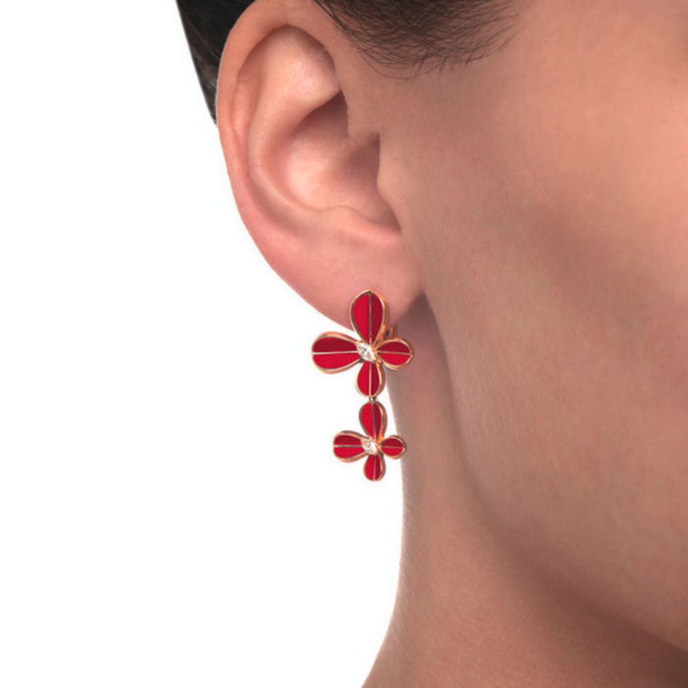 Close up of Samra Marquise Butterfly Rose Gold Dangling Earring worn by a model