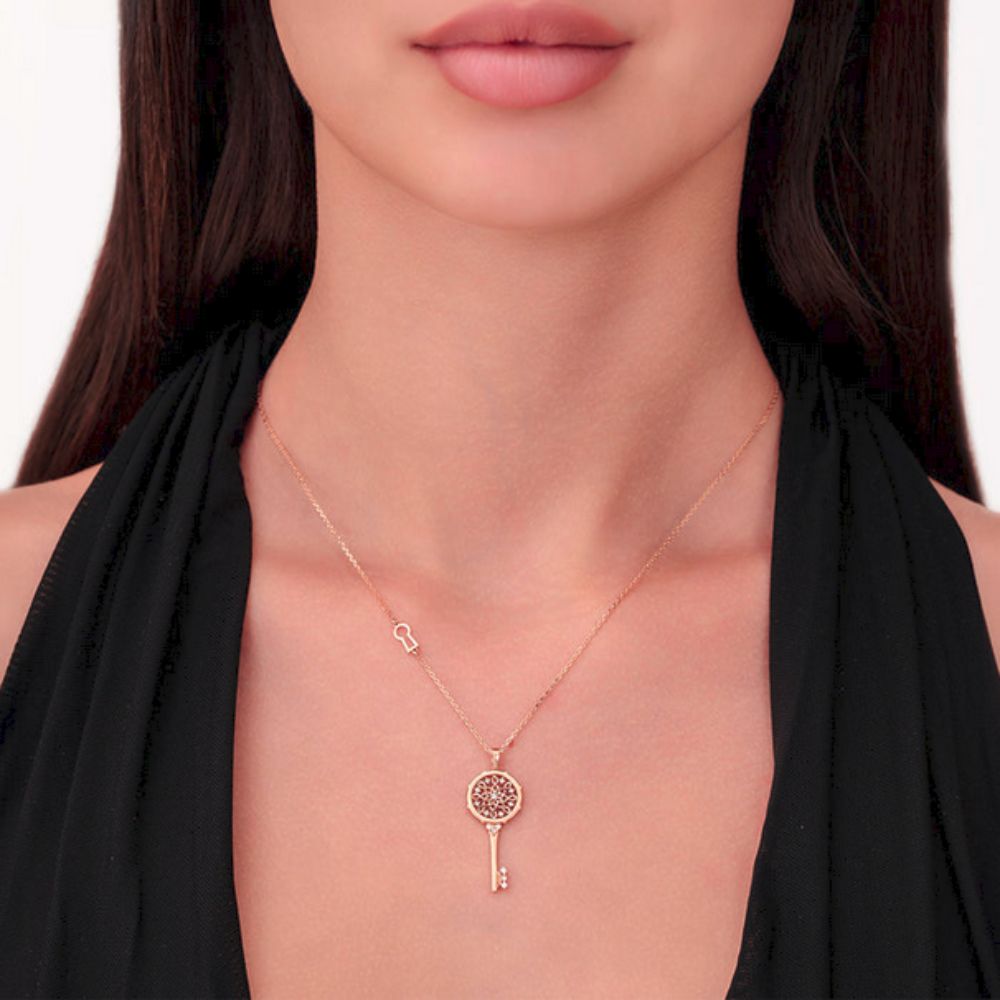 A model wearing Samra Muftah Turath Small Key Necklace