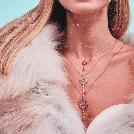 A model wearing Samra Muftah Turath Key Necklaces in all three sizes - Small, Medium and Large