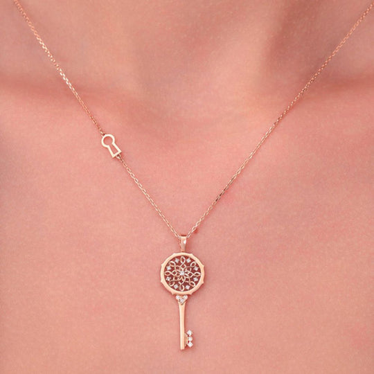 A model's neckline showing the Samra Muftah Turath Small Key Necklace