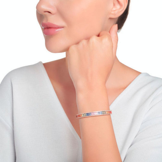 A model displaying the Samra Noor Rose Gold Baguette Sapphire Bangle on her wrist