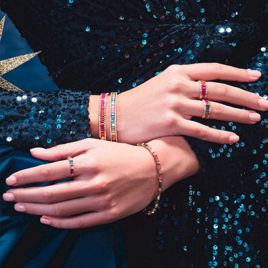 Samra Noor Rose Gold Baguette Sapphire Ring worn by a model along with jewelries from Samra