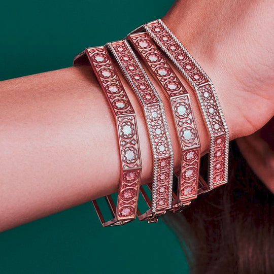 Multiple Samra Oud Turath Diamond Bangles on a wrist