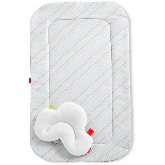Rectangular baby mat with a soft white pillow on a white background