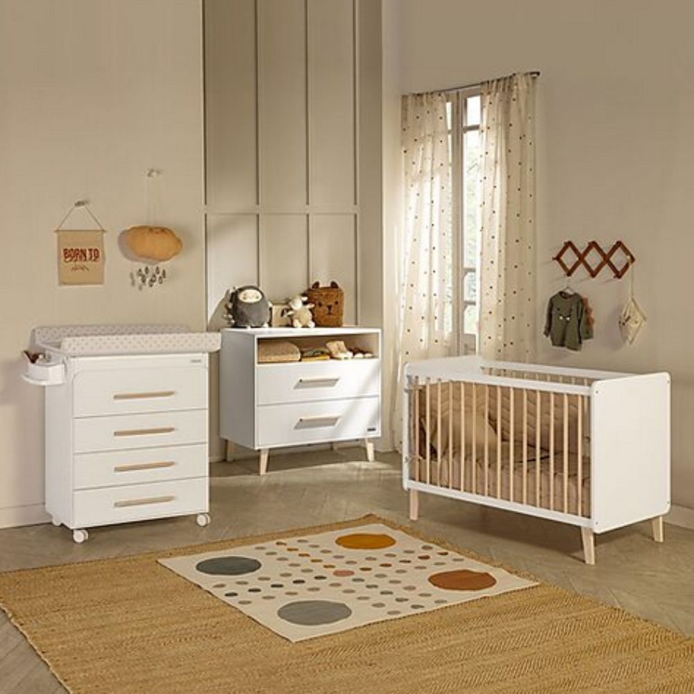 Nursery room with white crib, Space-Saving Micuna Trevi Baby Bathtub with Changing Pad & Storage, and wooden floor.