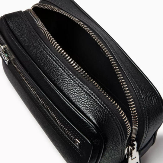 Close up of the opening of TOM FORD Logo-embossed Wash Bag in Leather