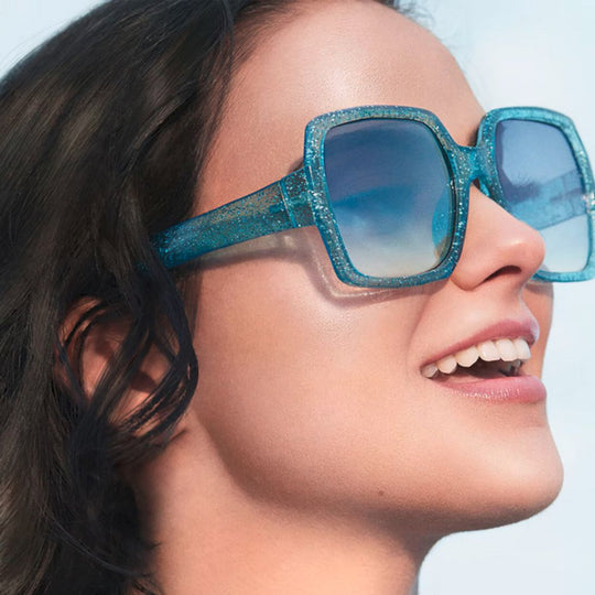 A model showing off her glowing face after application of Urban Decay Hydromaniac Glowy Tinted Hydrator Foundation