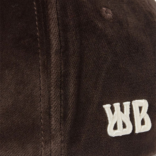 Close up view of logo embroidery on Wales Bonner Dark Brown Logo Embroidered Morning Velvet Cap
