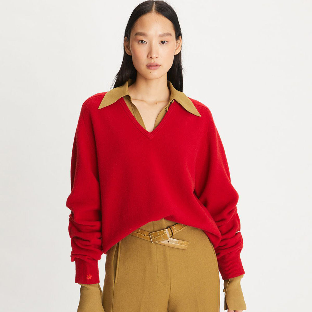 Model in Red Woollen V-Neck Sweater with a Flower on Sleeves