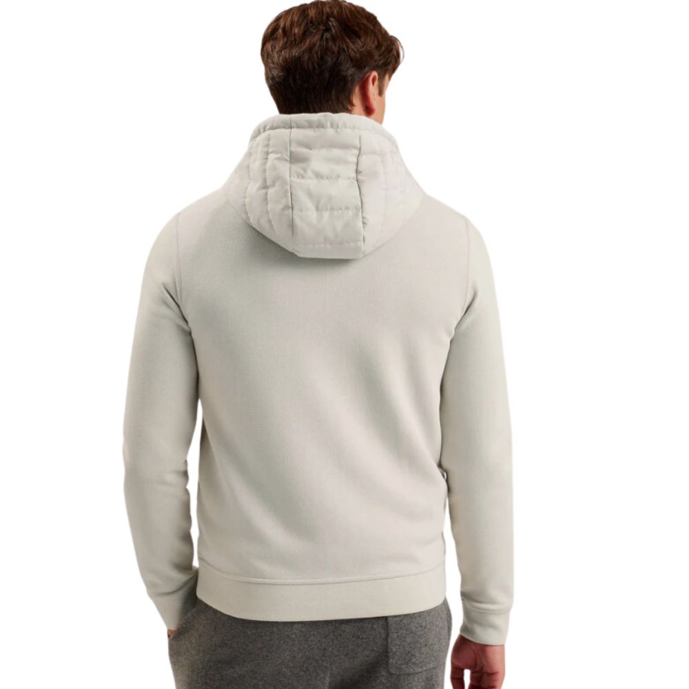 Back View of Man in Beige Quilted Jacket with Hoodie