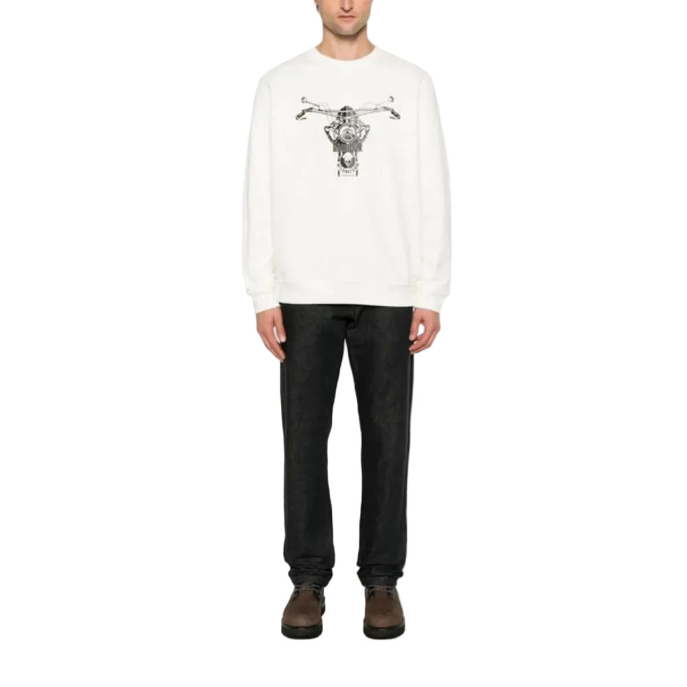 Person wearing a white sweater with a graphic design on a white background